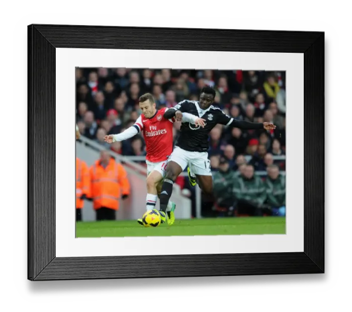 Framed Print : Wilshere vs. Wanyama: Intense Battle in Arsenal v Southampton (2013-14)