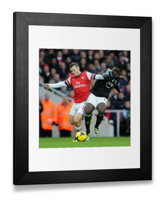 Framed Print : Arsenal vs Southampton: Wilshere vs Wanyama - Intense Battle in the Midfield (2013-14)