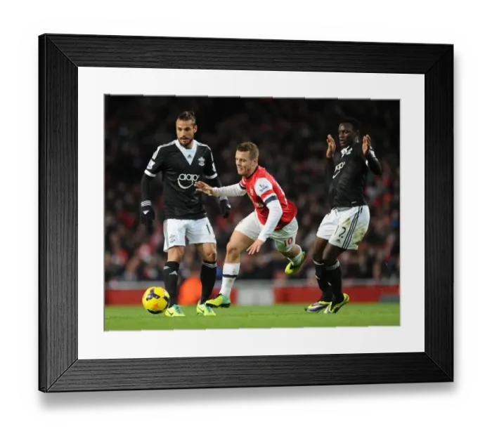 Framed Print : Arsenal's Jack Wilshere Faces Off Against Southampton's Victor Wanyama and Dani Osvaldo in Premier League Clash Framed Print : Arsenal's Jack Wilshere Faces Off Against Southampton's Victor Wanyama and Dani Osvaldo in Premier League Clash