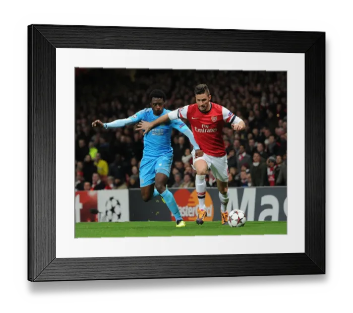 Framed Print : Arsenal's Olivier Giroud Clashes with Marseille's Nicolas N'Koulou in Champions League Showdown