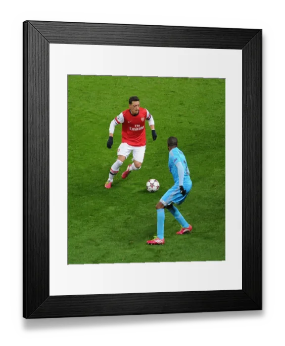 Framed Print : Mesut Ozil vs Kassim Abdallah: Intense Battle at Arsenal v Marseille, UEFA Champions League (2013-14) Framed Print : Mesut Ozil vs Kassim Abdallah: Intense Battle at Arsenal v Marseille, UEFA Champions League (2013-14)