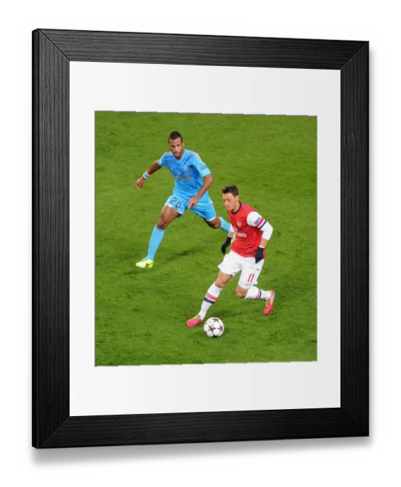 Framed Print : Mesut Ozil vs Alaixys Romao: Intense Battle at Arsenal v Marseille, UEFA Champions League (2013-14) Framed Print : Mesut Ozil vs Alaixys Romao: Intense Battle at Arsenal v Marseille, UEFA Champions League (2013-14)