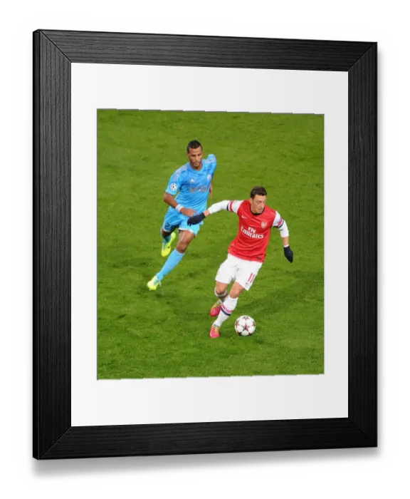 Framed Print : Mesut Ozil vs. Alaixys Romao: A Football Rivalry Ignites in the Arsenal vs. Marseille UEFA Champions League Clash, 2013 Framed Print : Mesut Ozil vs. Alaixys Romao: A Football Rivalry Ignites in the Arsenal vs. Marseille UEFA Champions League Clash, 2013