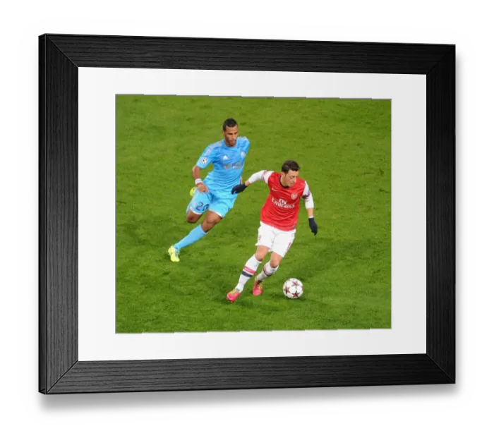 Framed Print : Mesut Ozil vs. Alaixys Romao: A Football Rivalry in the Arsenal vs. Marseille UEFA Champions League Clash Framed Print : Mesut Ozil vs. Alaixys Romao: A Football Rivalry in the Arsenal vs. Marseille UEFA Champions League Clash