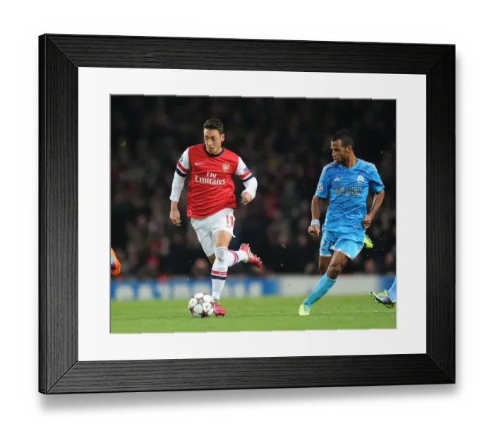 Framed Print : Mesut Ozil vs. Alaixys Romao: Arsenal vs. Marseille, UEFA Champions League, 2013