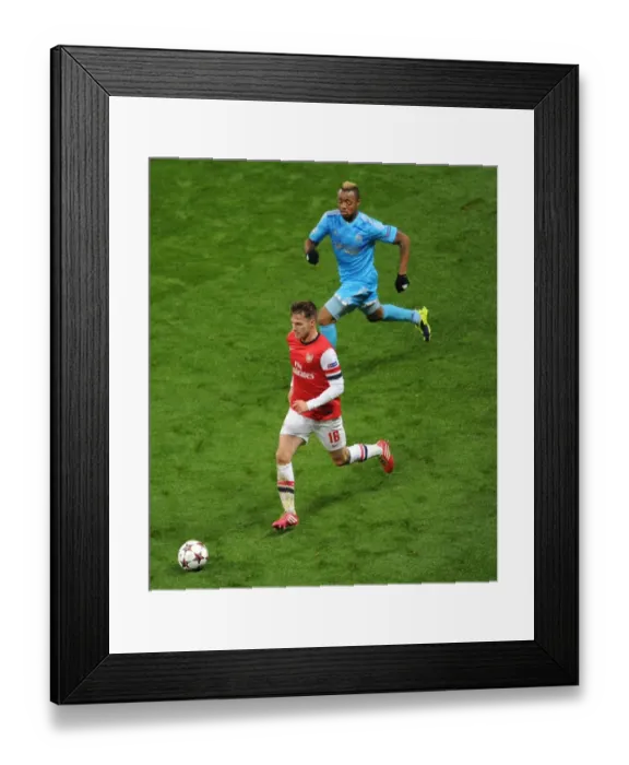 Framed Print : Arsenal vs Marseille: Ramsey vs Ayew - A Champions League Battle Framed Print : Arsenal vs Marseille: Ramsey vs Ayew - A Champions League Battle