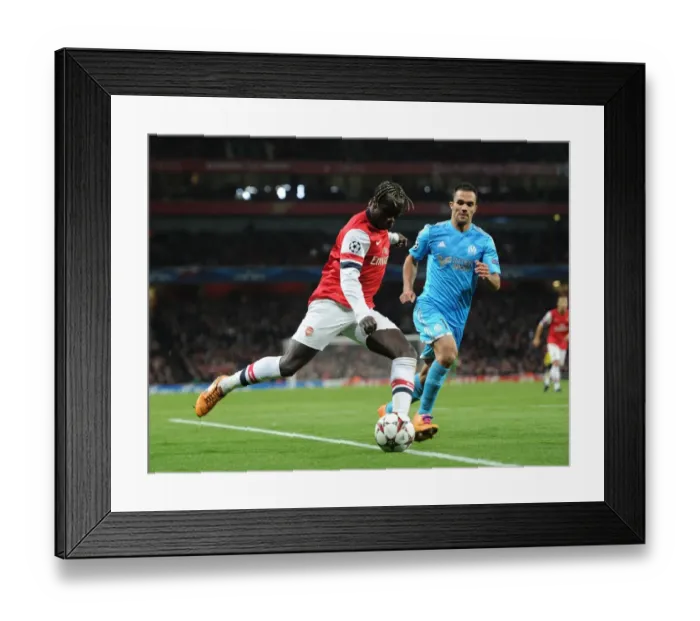 Framed Print : Battling Cross: Sagna vs. Morel in Arsenal's UEFA Champions League Clash (2013)