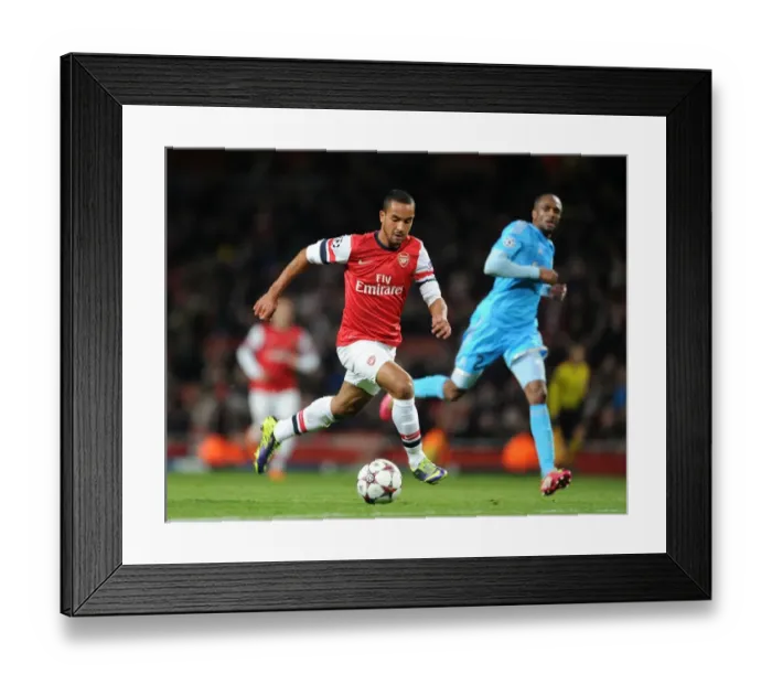 Framed Print : Theo Walcott in Action: Arsenal vs Marseille, UEFA Champions League (2013) Framed Print : Theo Walcott in Action: Arsenal vs Marseille, UEFA Champions League (2013)