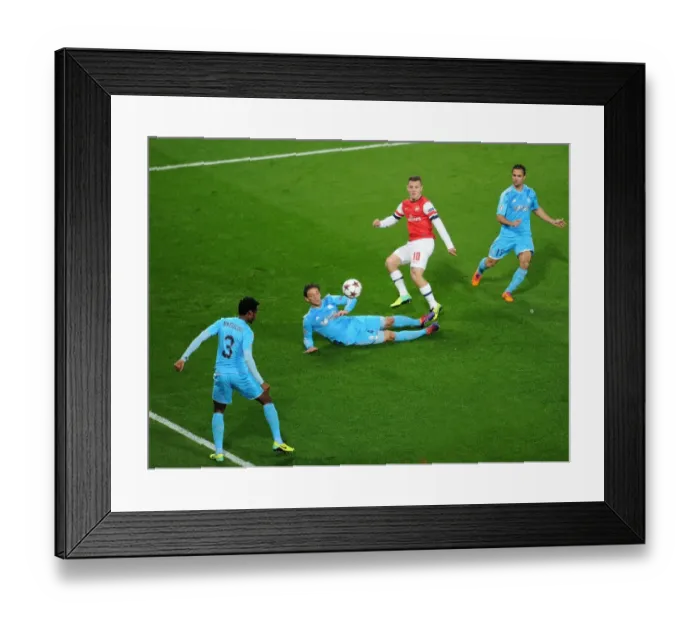 Framed Print : Jack Wilshere Scores Dramatic Goal Past Lucas Mendes and Nicolas N'Koulou: Arsenal vs. Olympique de Marseille, UEFA Champions League, 2013 Framed Print : Jack Wilshere Scores Dramatic Goal Past Lucas Mendes and Nicolas N'Koulou: Arsenal vs. Olympique de Marseille, UEFA Champions League, 2013
