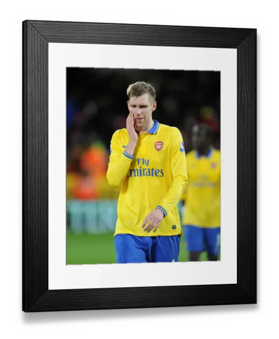 Framed Print : Per Mertesacker (Arsenal). Cardiff City 0: 3 Arsenal. Barclays Premier League. Cardiff City Stadium