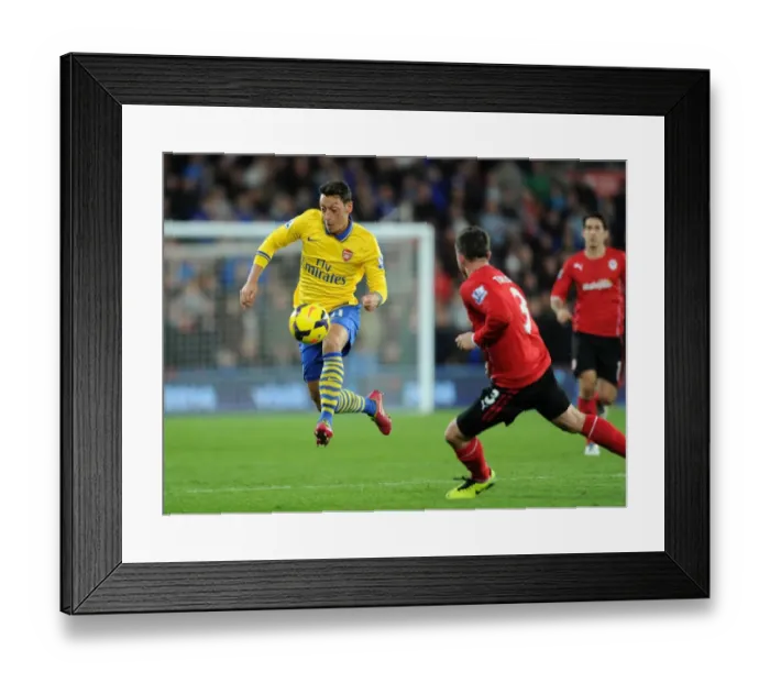 Framed Print : Mesut Ozil Outmaneuvers Andrew Taylor: Cardiff City vs. Arsenal, Premier League 2013-14