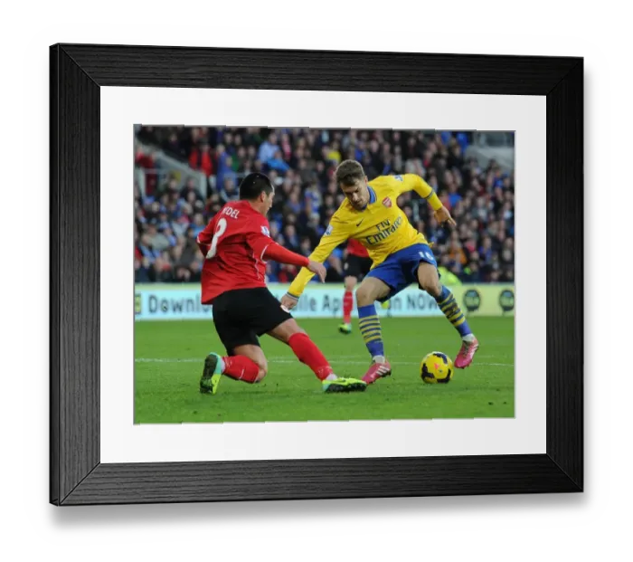 Framed Print : Aaron Ramsey vs. Gary Medel: Intense Battle in Cardiff City vs. Arsenal (Premier League 2013-14)