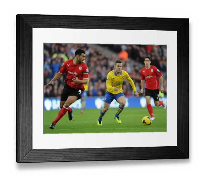Framed Print : Arsenal's Aaron Ramsey Tangles with Steven Caulker in Premier League Clash (Cardiff City vs Arsenal, 2013)