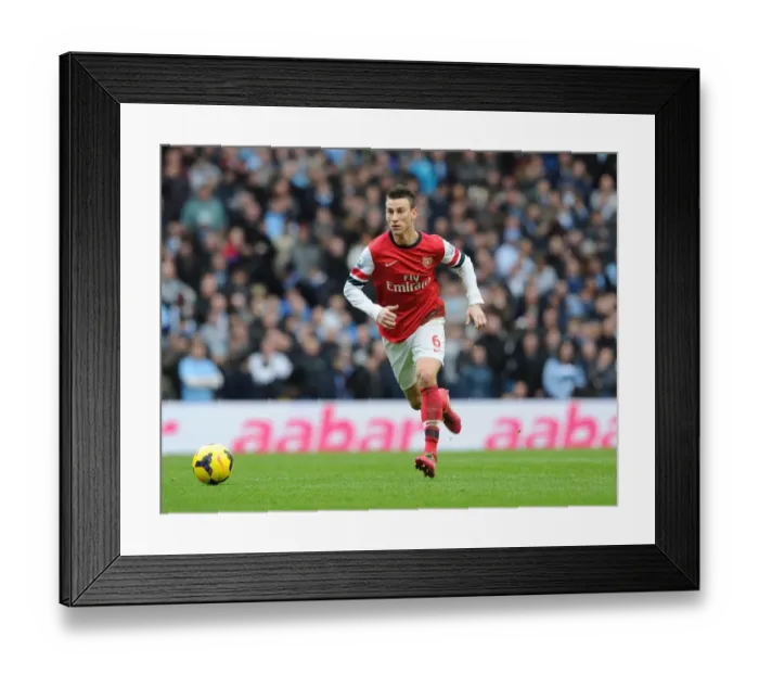 Framed Print : Laurent Koscielny (Arsenal). Manchester City 6: 3 Arsenal. Barclays Premier League Framed Print : Laurent Koscielny (Arsenal). Manchester City 6: 3 Arsenal. Barclays Premier League