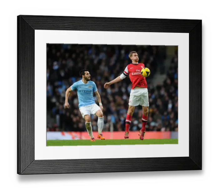 Framed Print : Per Mertesacker vs. Alvaro Negredo: Intense Battle at Manchester City vs. Arsenal (2013-14 Premier League) Framed Print : Per Mertesacker vs. Alvaro Negredo: Intense Battle at Manchester City vs. Arsenal (2013-14 Premier League)