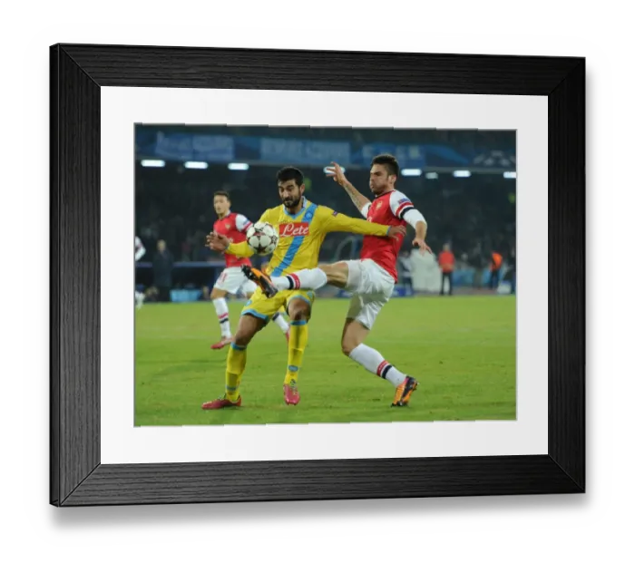 Framed Print : Giroud vs. Albiol: Tense Moment in Napoli vs. Arsenal UEFA Champions League Clash