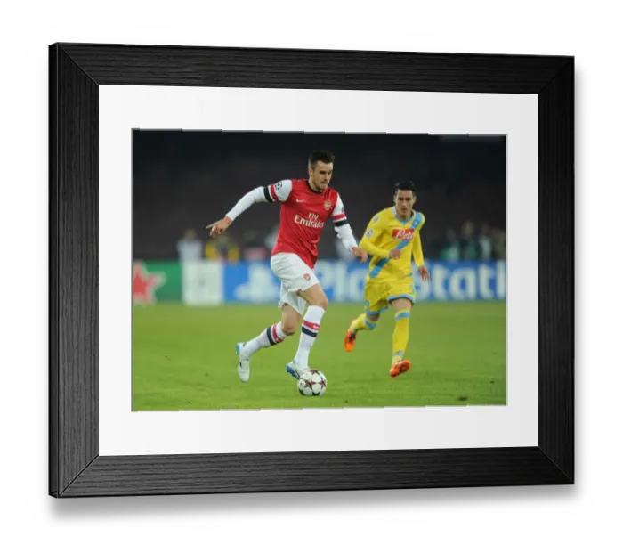 Framed Print : Clash in Naples: Jenkinson Outruns Callejon in UEFA Champions League Showdown