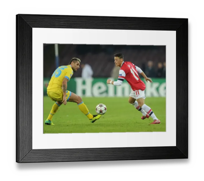 Framed Print : Clash in Naples: Ozil vs. Behrami - Napoli v Arsenal, UEFA Champions League, 2013