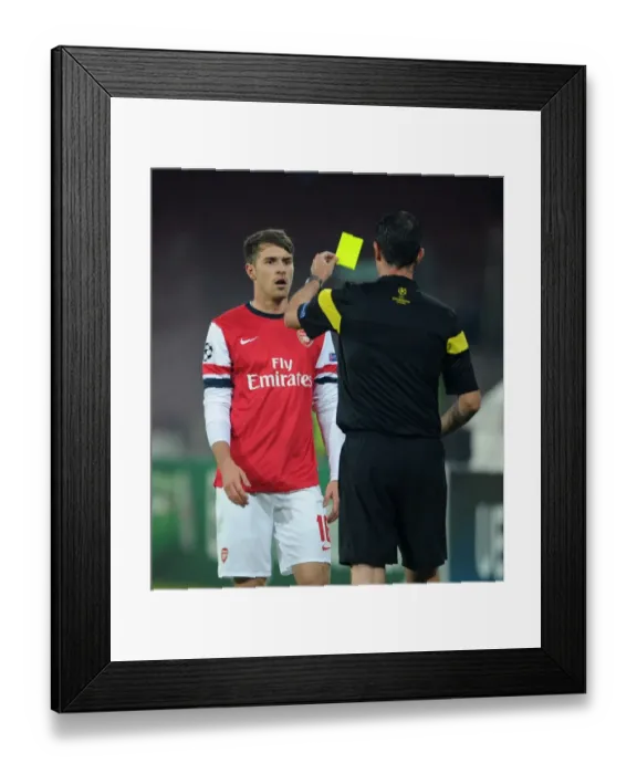 Framed Print : Aaron Ramsey Yellow Carded by Referee Viktor Kassai in Napoli v Arsenal UEFA Champions League Match Framed Print : Aaron Ramsey Yellow Carded by Referee Viktor Kassai in Napoli v Arsenal UEFA Champions League Match