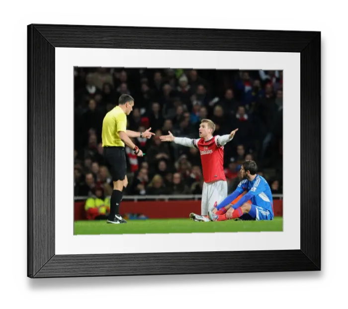 Framed Print : Per Mertesacker Contests Challenge from Danny Graham: Arsenal vs Hull City, Premier League, 2013