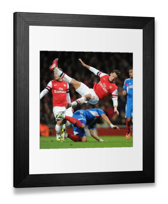 Framed Print : Mesut Ozil vs. Liam Rosenior: Intense Battle at Arsenal v Hull City (2013-14) Framed Print : Mesut Ozil vs. Liam Rosenior: Intense Battle at Arsenal v Hull City (2013-14)