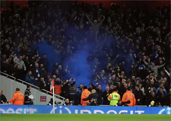 Everton fans let off a blue flare. Arsenal 1: 1 Everton. Barclays Premier League. Emirates Stadium