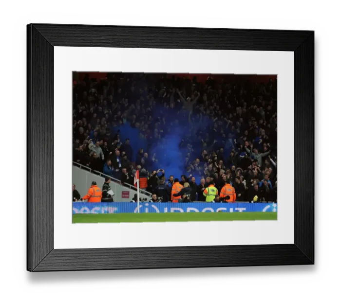 Framed Print : Everton fans let off a blue flare. Arsenal 1: 1 Everton. Barclays Premier League. Emirates Stadium Framed Print : Everton fans let off a blue flare. Arsenal 1: 1 Everton. Barclays Premier League. Emirates Stadium