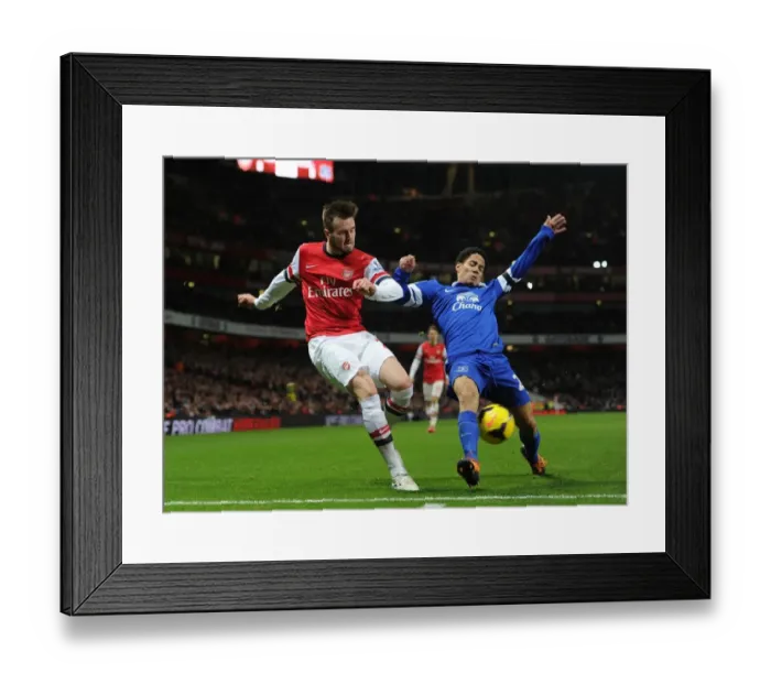 Framed Print : Arsenal vs. Everton: Jenkinson vs. Pienaar in Intense Premier League Clash