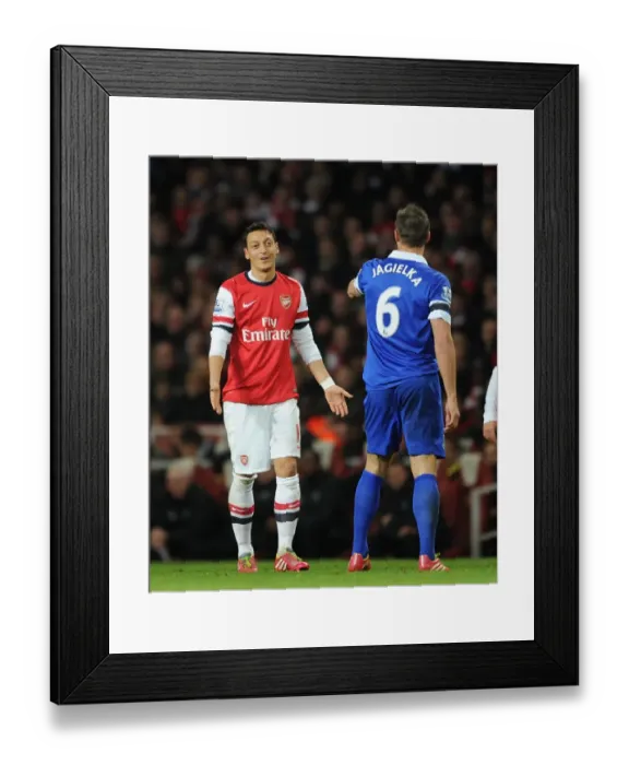 Framed Print : Mesut Ozil and Phil Jagielka: A Moment of Respite Amidst the Arsenal v Everton Rivalry (2013-14) Framed Print : Mesut Ozil and Phil Jagielka: A Moment of Respite Amidst the Arsenal v Everton Rivalry (2013-14)