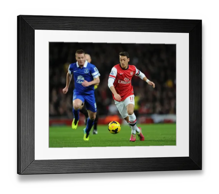 Framed Print : Mesut Ozil vs James McCarthy: Intense Battle at Arsenal v Everton, Premier League 2013-14