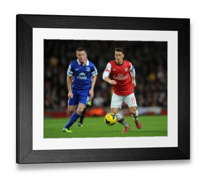 Framed Print : Mesut Ozil vs. James McCarthy: A Premier League Showdown at Arsenal