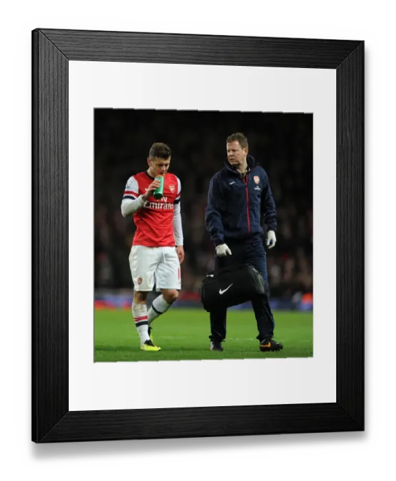 Framed Print : Jack Wilshere (Arsenal) and Arsenal Physio Colin Lewin. Arsenal 1: 1 Everton. Barclays