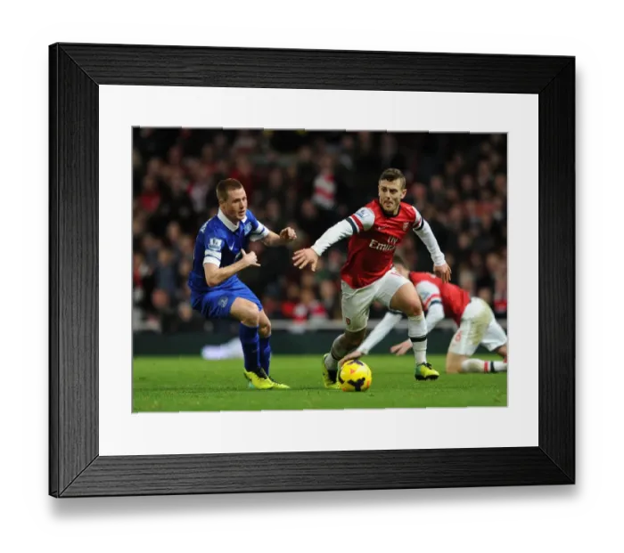 Framed Print : Arsenal's Jack Wilshere vs Everton's James McCarthy: Intense Battle in the Midfield, Premier League 2013-14 Framed Print : Arsenal's Jack Wilshere vs Everton's James McCarthy: Intense Battle in the Midfield, Premier League 2013-14