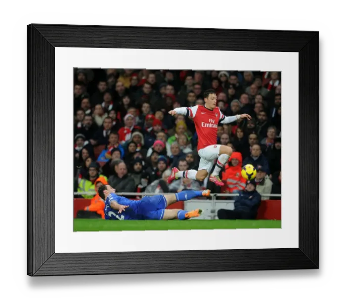 Framed Print : Mesut Ozil Evades Branislav Ivanovic: Intense Moment from the Arsenal vs Chelsea Clash (2013-14)