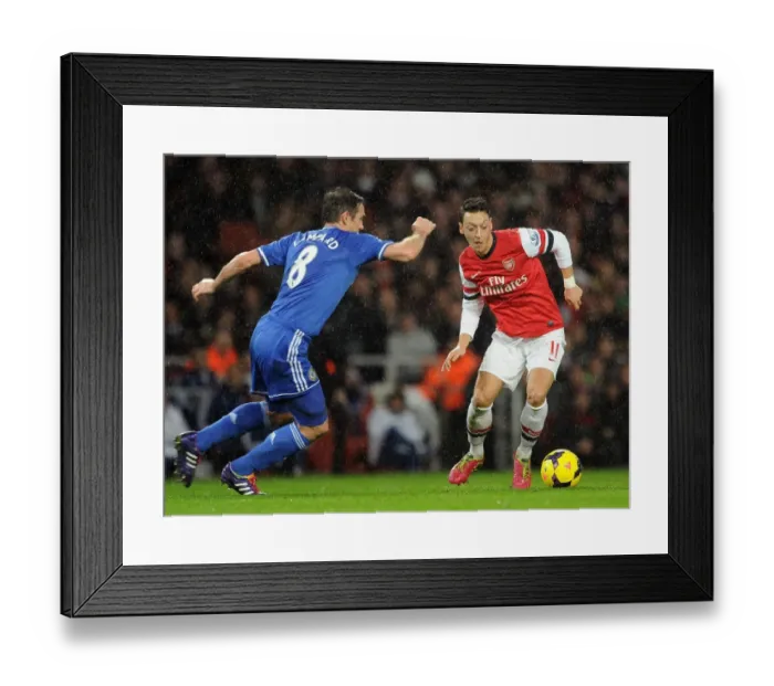 Framed Print : Mesut Ozil vs. Frank Lampard: A Premier League Rivalry - Arsenal vs. Chelsea (2013-14): Clash of Midfield Maestros