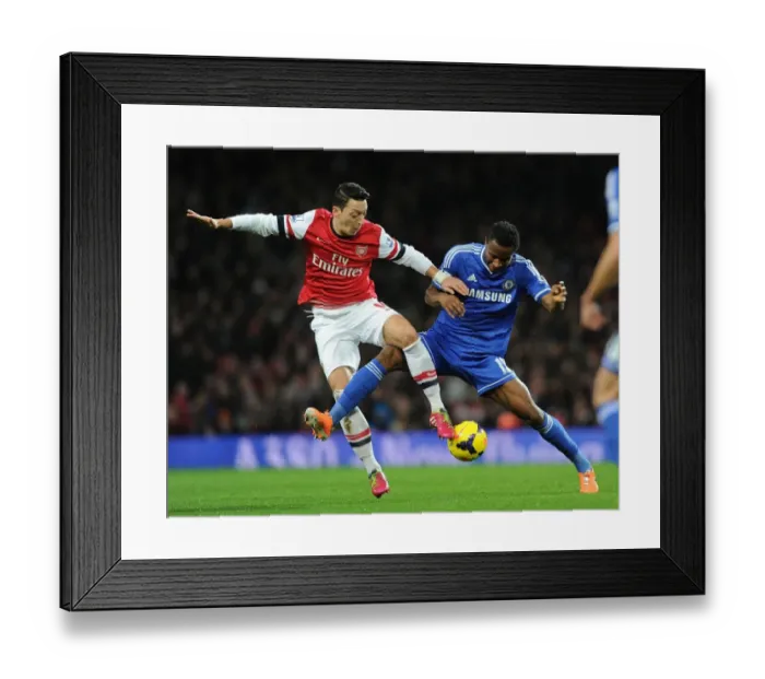 Framed Print : Mesut Ozil vs. John Obi Mikel: Intense Battle at Arsenal v Chelsea (Premier League 2013-14) Framed Print : Mesut Ozil vs. John Obi Mikel: Intense Battle at Arsenal v Chelsea (Premier League 2013-14)