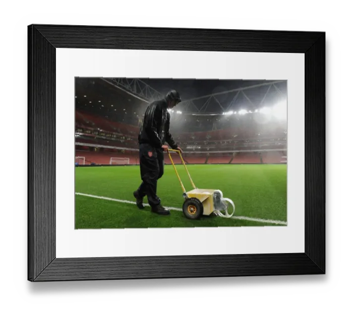 Framed Print : Arsenal Groundsman Sion Bennett Braves the Rain to Prepare for Arsenal vs. Chelsea Showdown Framed Print : Arsenal Groundsman Sion Bennett Braves the Rain to Prepare for Arsenal vs. Chelsea Showdown