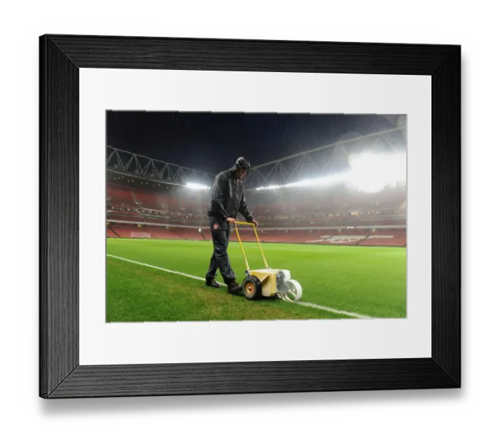 Framed Print : Arsenal Groundsman Sion Bennett Battles the Rain to Prepare for Arsenal vs. Chelsea Showdown Framed Print : Arsenal Groundsman Sion Bennett Battles the Rain to Prepare for Arsenal vs. Chelsea Showdown