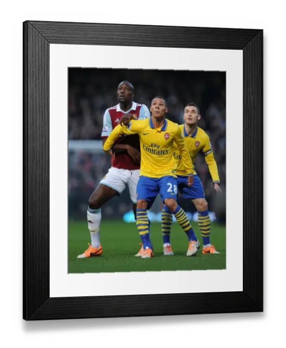 Framed Print : Clash at Boleyn Ground: Kieran Gibbs vs. Carlton Cole - Arsenal vs. West Ham United, Premier League (December 2013)