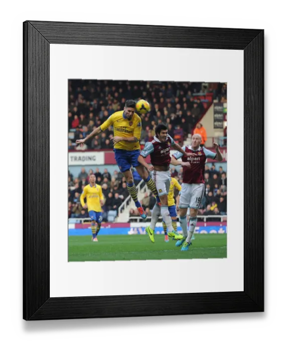 Framed Print : Olivier Giroud (Arsenal) James Collins and James Tomkins (West Ham). West Ham United 1: 3 Arsenal