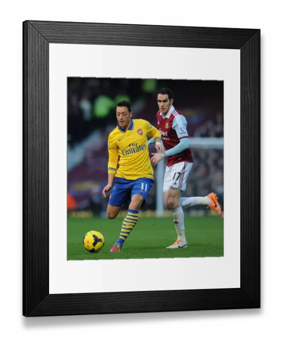 Framed Print : Mesut Ozil Outwits Joey O'Brien: Premier League Showdown between Arsenal and West Ham, 2013 Framed Print : Mesut Ozil Outwits Joey O'Brien: Premier League Showdown between Arsenal and West Ham, 2013