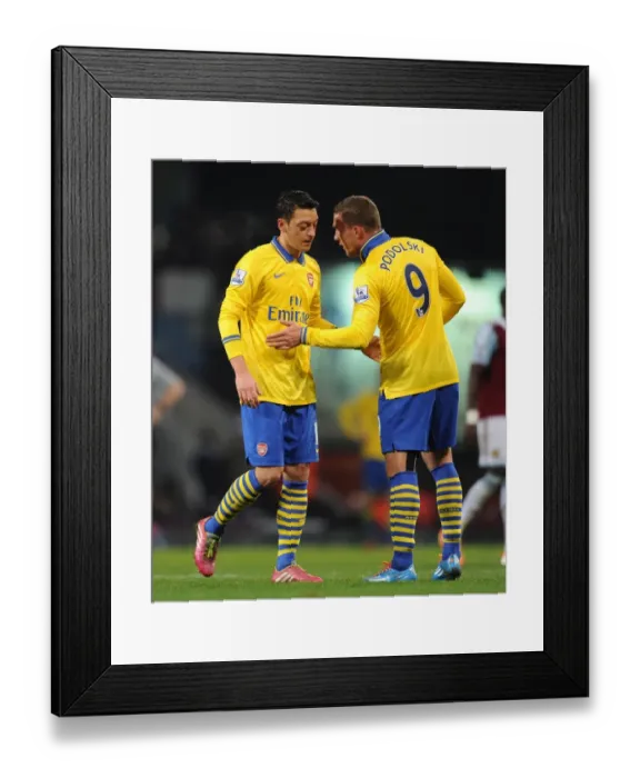 Framed Print : Mesut Ozil and Lukas Podolski (Arsenal). West Ham United 1: 3 Arsenal. Barclays Premier League