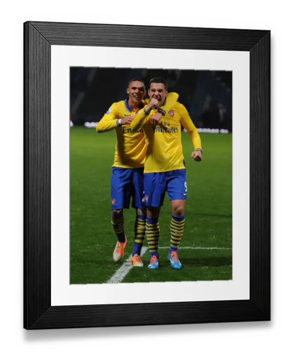 Framed Print : Arsenal's Jubilant Duo: Podolski and Gibbs Celebrate Victory over West Ham United
