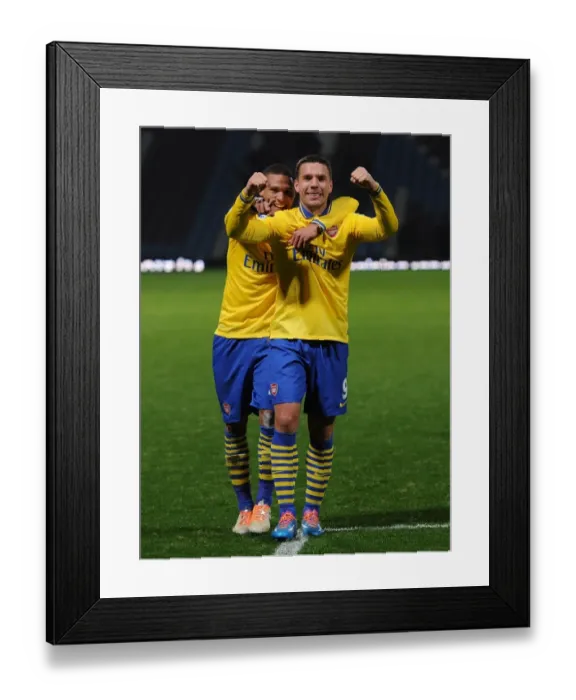 Framed Print : Arsenal's Jubilant Winning Moment: Podolski and Gibbs Celebrate against West Ham United