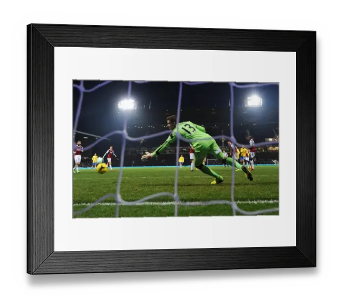 Framed Print : Podolski Scores the Third: Arsenal Triumphs Over West Ham in Premier League Clash Framed Print : Podolski Scores the Third: Arsenal Triumphs Over West Ham in Premier League Clash