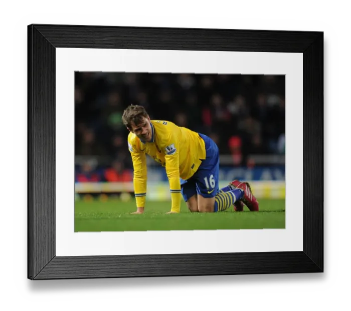 Framed Print : Aaron Ramsey's Christmas Misfortune: Injured in Arsenal's Battle against West Ham United (2013-14)