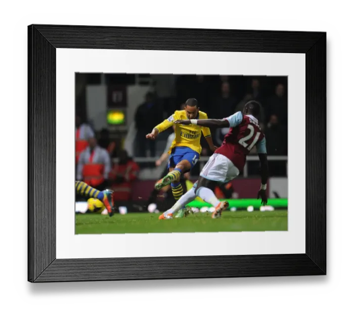 Framed Print : Theo Walcott Scores Against Mohamed Diame: A Pivotal Moment in the 2013-14 West Ham United vs. Arsenal Premier League Clash Framed Print : Theo Walcott Scores Against Mohamed Diame: A Pivotal Moment in the 2013-14 West Ham United vs. Arsenal Premier League Clash