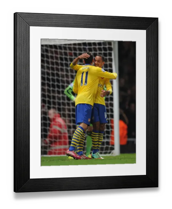 Framed Print : Theo Walcott and Mesut Ozil Celebrate Goals: West Ham United vs. Arsenal (2013-14)