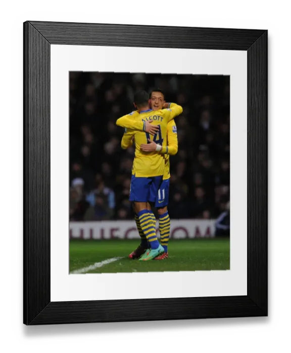 Framed Print : Theo Walcott and Mesut Ozil Celebrate Arsenal's Second Goal vs. West Ham United (2013-14) Framed Print : Theo Walcott and Mesut Ozil Celebrate Arsenal's Second Goal vs. West Ham United (2013-14)