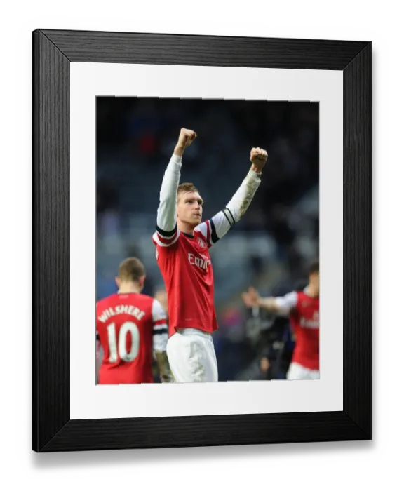 Framed Print : Per Mertesacker's Triumph: Arsenal's Victory over Newcastle United, Premier League 2013-14 - The Unforgettable Moment of Per Mertesacker's Celebration at St. James Park